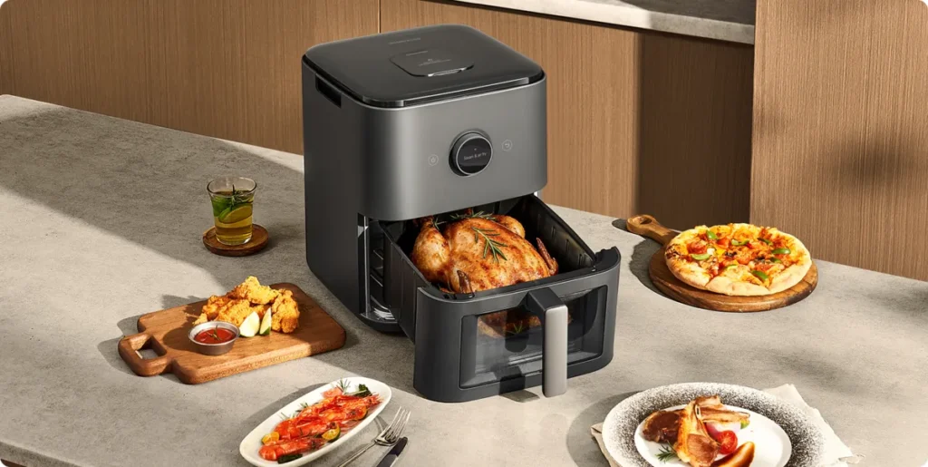 Xiaomi Mijia Smart Steam Air Fryer 7L Black (BHR08U4EU) Mijia Smart Steam Air Fryer 7L στον πάγκο με οικογενειακά πιάτα