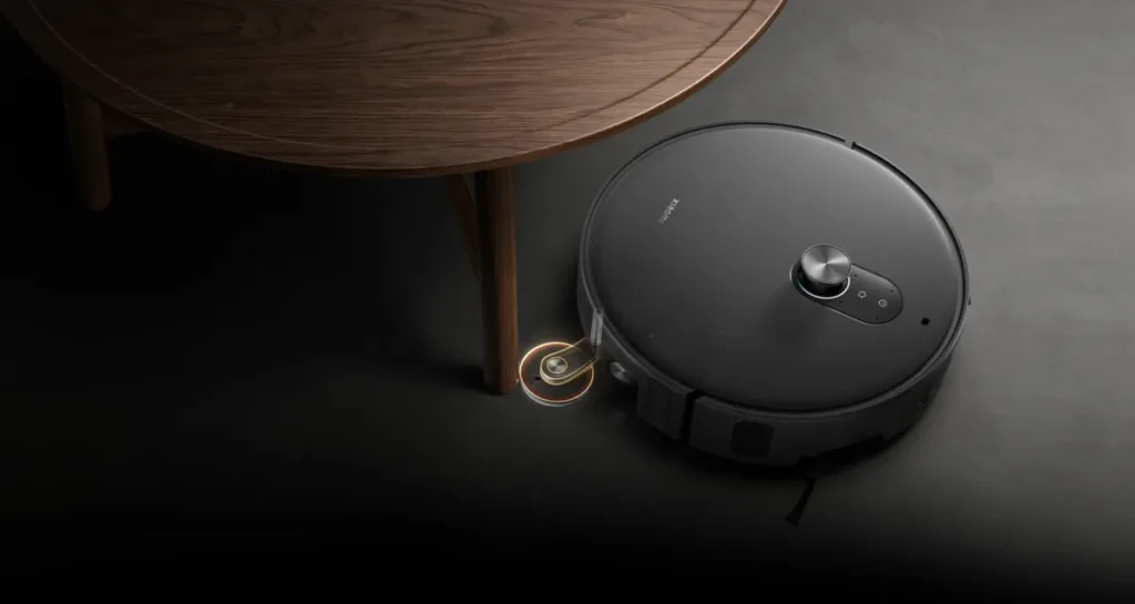 Xiaomi Robot Vacuum 6 Max Σκούπα Ρομπότ με Wi-Fi Warm Grey (BHR08V2EU) Βραχίονας της Robot Vacuum 6 Max γύρω από πόδι τραπεζιού